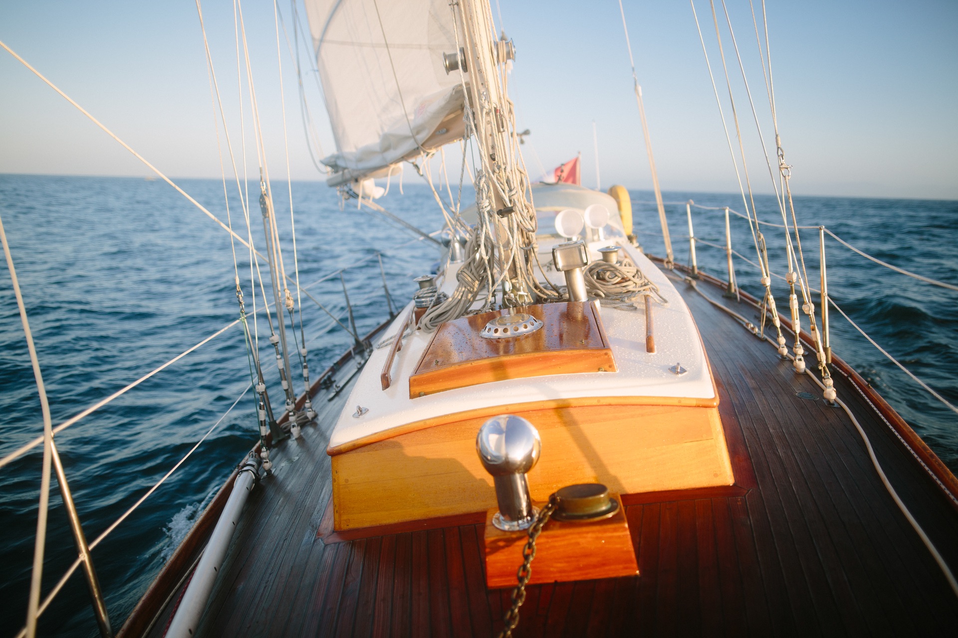 Jura's teak deck stretching toward the open strait